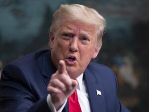 In this file photo US President Donald Trump speaks to reporters after participating in a Thanksgiving teleconference with members of the United States Military, at the White House in Washington, DC, on November 26, 2020. AFP