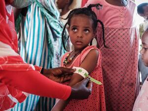 A four-year-old Ethiopian girl who fled the Tigray conflict as a refugee is measured at a malnutrition center at Village Eight transit centre near the Ethiopian border in Gedaref, eastern Sudan, on December 2, 2020. Yasuyoshi CHIBA / AFP
