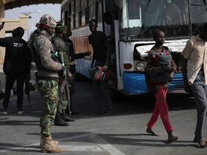 Released students from the Government Science Secondary school, in Kankara, in northwestern Katsina State, Nigeria leave the busses before being led into the Government House upon their release on December 18, 2020. More than 300 Nigerian schoolboys were released on Thursday after being abducted in an attack claimed by Boko Haram, officials said, although it was unclear if any more remained with their captors Kola SULAIMON / AFP