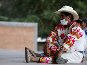 Indigenous Wixarika people from Jalisco and Durango participate in the Wixarika Regional Council in Mezquital, Durango state, Mexico, on December 17, 2020, amid the COVID-19 coronavirus pandemic. The Wixarika Regional Council was formed to defend the Wirikuta Sacred Zone where many ancient traditions and customs are kept alive. ULISES RUIZ / AFP
