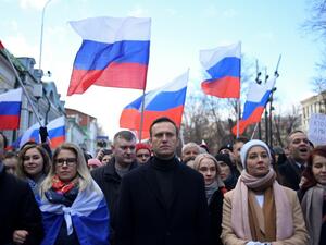  In this file photo taken on February 29, 2020 Russian opposition leader Alexei Navalny, his wife Yulia, opposition politician Lyubov Sobol and other demonstrators march in memory of murdered Kremlin critic Boris Nemtsov in downtown Moscow. Russian investigators on December 29, 2020, opened a criminal probe into Kremlin critic Alexei Navalny, alleging he spent more than 356 million rubles ($4.8 million) of donations to his organisations on personal acquisitions. Kirill KUDRYAVTSEV / AFP