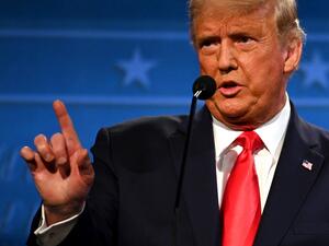  In this file photo taken on October 22, 2020 US President Donald Trump gestures as he speaks during the final presidential debate at Belmont University in Nashville, Tennessee. President Donald Trump on December 22, 2020 rejected a $900 billion bipartisan Covid stimulus package, calling it "a disgrace" and demanding that lawmakers more than triple relief payments to Americans. JIM WATSON / AFP