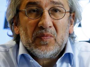 In this file photo taken on September 28, 2018 Can Dundar, Turkish journalist and former chief editor of the Turkish daily newspaper Cumhuriyet addresses a press conference in Berlin. A Turkish court on December 23, 2020 sentenced the exiled former editor-in-chief of the opposition Cumhuriyet daily to more than 27 years in jail on charges of aiding a terror group and espionage. The court found Can Dundar -- who fled to Germany in 2016 -- guilty in connection with a story about an alleged Turkish arms shipme