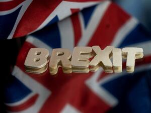 This file photograph taken on December 10, 2020, shows the flags of the United Kingdom and the European Union next to the "Brexit" word in Brussels. The 27 EU member states gave the green light on December 28, 2020, for the post-Brexit trade deal to go into effect on January 1,2021, a spokesman said. Ambassadors from EU capitals met in Brussels to nod through the accord, using a procedure which will take effect at 3:00 pm (1400 GMT) on December 29.  Kenzo TRIBOUILLARD / AFP