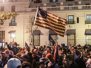 Thousands of protesters who refuse to accept that President-elect Joe Biden won the election are rallying ahead of the electoral college vote to make Trump's 306-to-232 loss official. Stephanie Keith/Getty Images/AFP