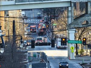 Police close off an area damaged by an explosion on Christmas morning on December 25, 2020 in Nashville, Tennessee. A Hazardous Devices Unit was en route to check on a recreational vehicle which then exploded outside An Intentional explosion on Christmas morning causes Significant damage in downtown Nashville Terry Wyatt/Getty Images/AFP Terry Wyatt / GETTY IMAGES NORTH AMERICA / Getty Images via AFP