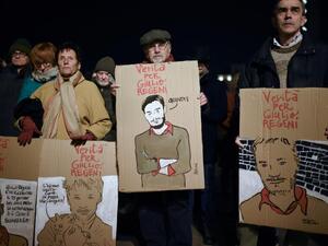 Activists of human rights organisation Amnesty International take part in a demonstration in Piazza Castello in Turin on 25 January (AFP/File photo)