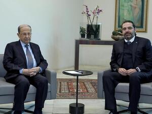 A handout picture provided by the Lebanese photo agency Dalati and Nohra on December 19, 2019 shows Lebanese President Michel Aoun (L) meeting with caretaker Prime Minister Saad Hariri at the presidential palace in Baabda, east of Beirut. AFP