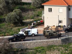 A picture taken from Lebanon's southern Tallet al-Hamamsah hill shows Israeli security forces on a road in the Israeli northern town of Metula, by the border blue line, on January 3, 2021, as Hezbollah supporters and members mark the first anniversary of the killing of slain Iraqi commander Abu Mahdi al-Muhandis, and Iranian Revolutionary Guards commander Qasem Soleimani. Ali DIA / AFP