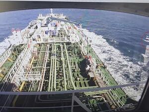 A CCTV footage of the Hankuk Chemi, a South Korean-flagged oil tanker, is displayed on a screen as a boat of Iran's Revolutionary Guards is seen in red circle on the screen at the tanker's owner company DM Shipping, in Busan on January 4, 2021. South Korea's foreign ministry on January 4 demanded the "early release" of an oil tanker seized by Iran in Gulf waters for breaking maritime environmental laws. YONHAP / AFP