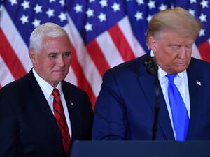In this file photo US President Donald Trump and US Vice President Mike Pence(L) speak during election night in the East Room of the White House in Washington, DC, early on November 4, 2020. MANDEL NGAN / AFP