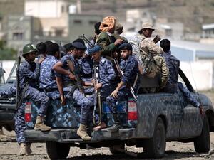 In this file photo taken on September 17, 2019, Yemeni Shiite Huthi police forces sit in the back of a military vehicle in the capital Sanaa during a protest against the Saudi intervention in their country. MOHAMMED HUWAIS / AFP