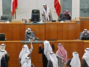 Kuwaiti MPs speak with parliament speaker Marzouq al-Ghanim (Top-C) after the national assembly session was adjourned due to cabinet's resignation, in Kuwait City on January 19, 2021. YASSER AL-ZAYYAT / AFP