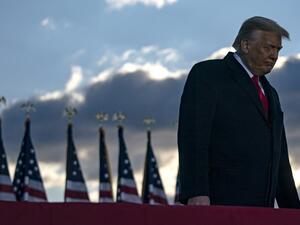 Outgoing US President Donald Trump addresses guests at Joint Base Andrews in Maryland on January 20, 2021. President Trump and the First Lady travel to their Mar-a-Lago golf club residence in Palm Beach, Florida, and will not attend the inauguration for President-elect Joe Biden. ALEX EDELMAN / AFP