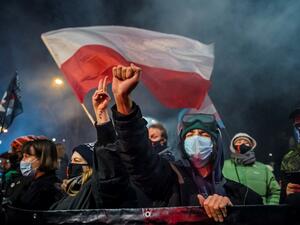 A demonstrator gestures as people take part in a pro-choice protest in the center of Warsaw, on January 27, 2021, as part of a nationwide wave of protests since October 22, 2020 against Poland's near-total ban on abortion. A demonstrator holds a banner reading "Abortion on demand" as she takes part in a pro-choice protest in the center of Warsaw, on January 27, 2021, as part of a nationwide wave of protests since October 22, 2020 against Poland's near-total ban on abortion. A controversial Polish court ruli