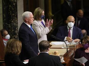 Vice President Mike Pence (L) and U.S. Speaker of the House Nancy Pelosi (D-CA) look on as the the count of electoral votes continues in the House Chamber during a reconvening of a joint session of Congress on January 07, 2021 in Washington, DC. (AFP)