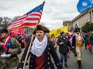 Supporters of US President Donald Trump march through the streets of the city as they make their way to the Capitol Building in Washington, on January 6, 2021. (AFP)