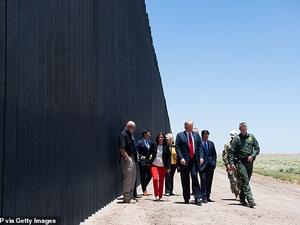 His visit to one of the biggest promises of his presidency comes as Democrats will move to vote as early as Wednesday on impeachment. (AFP)