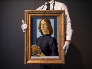 لوحة young man holding a roundel 