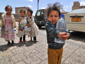 Unidentified girls with empty water-pots going in search of drinking water in Sana, Yemen. (Shutterstock/ File Photo)