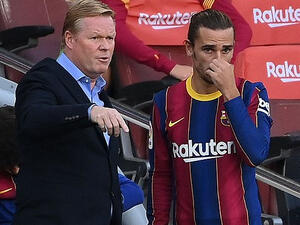 أنتوان غريزمان (يمين) ورونالد كومان