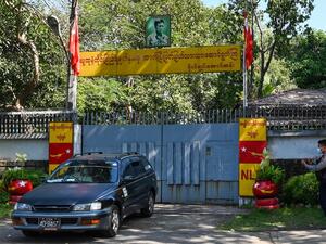 A car leaves the residence of Aung San Suu Kyi in Yangon on February 2, 2021, as Myanmar's generals appeared in firm control a day after a surgical coup that saw democracy heroine Suu Kyi detained. STR / AFP