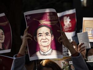 Myanmar activists hold an image of their country's civilian president Win Myint as they protest outside the Myanmar embassy in Tokyo on February 7, 2021, after the country's military on February 1 seized power in a bloodless coup and detained its civilian leader Aung San Suu Kyi. Philip FONG / AFP