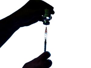 A health worker prepares an injection of the AstraZeneca/Oxford Covid-19 vaccine on February 7, 2021 at the Mignot Hospital in Le Chesnay near Paris. The top French medical authority Haute autorité de Santé has approved the vaccine for use in France, but only for people under 65, echoing decisions made in Sweden, Germany, Belgium and Switzerland over concerns about a lack of data on the effectiveness of the vaccine for over 65s.  ALAIN JOCARD / AFP