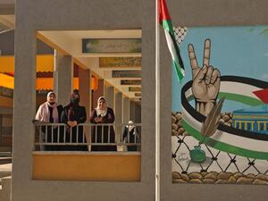 Palestinian teachers are pictured near the opening of the first Voter Information and Registration Centre in Gaza City on February 10, 2021. Rival Palestinian factions Fatah and Hamas said they had agreed on "mechanisms" for forthcoming elections and to respect their outcome, after years of bitter divisions. The parliamentary and presidential polls are set for May 22 and July 31, respectively. Mohammed ABED / AFP