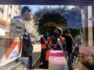 Palestinian members of Central Elections Commission register voters for the upcoming elections, on February 10, 2021 in Gaza City . Rival Palestinian factions Fatah and Hamas said they had agreed on "mechanisms" for forthcoming elections and to respect their outcome, after years of bitter divisions. The parliamentary and presidential polls are set for May 22 and July 31, respectively. MAHMUD HAMS / AFP