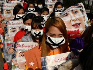 Activists take part in a protest against the military coup in Myanmar in Tokyo on February 14, 2021. CHARLY TRIBALLEAU / AFP