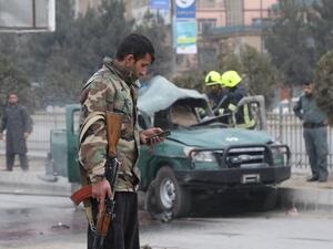 Policemen arrive at a site of a bomb blast which killed at least two people and injured five others, in Kabul on February 21, 2021. STR / AFP