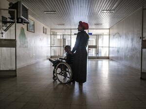Arsema Berha, 9-years-old, is pushed by her mother as she sits in a wheelchair at the Ayder Referral Hospital in the Tigray capital Mekele on February 25, 2021, after being injured during fighting between the Tigray People's Liberation Front (TPLF) which fell after Ethiopian Prime Minister deployed troops and warplanes to oust the TPLF late last year. (AFP/File)