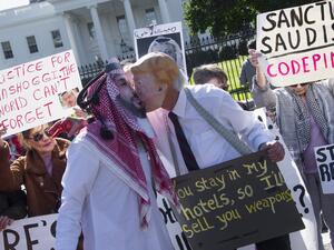  In this file photo taken on October 19, 2018, demonstrators dressed as Saudi Arabian Crown Prince Mohammed bin Salman and US President Donald Trump (C) pretend to kiss outside the White House in Washington, DC, demanding justice for missing Saudi journalist Jamal Khashoggi. The US director of national intelligence is expected to release a damning report on February 26, 2021, that fingers Saudi Crown Prince Mohammed bin Salman for the brutal murder and dismemberment of dissident journalist Jamal Khashoggi i