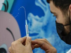 A health worker prepares a dose of the Pfizer-BioNtech COVID-19 coronavirus vaccine at Clalit Health Services, in Israel’s Mediterranean coastal city of Tel Aviv on Jan. 23, 2021. (File/AFP)