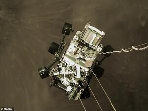 NASA shared an exciting image shot by the sky crane that shows Perseverance, nicknamed Perky, slung beneath and attached to mechanical bridals – moments before making landfall. NASA believes this image will become an iconic picture of spaceflight history. (NASA)