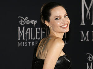 The image is of the 12th-century mosque in Marrakech at sunset