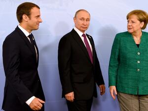 بوتين وميركل وماكرون 