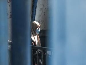 An elderly refugee awaits for UNRWA aid  