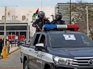 Libyan security forces keep watch outside the Ouagadougou Conference 