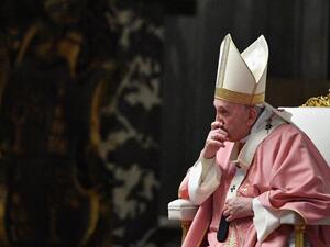 Pope Francis listens to Philippine Cardinal Luis Antonio Tagle