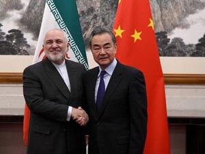 Zarif and Wang Yi: A good handshake 