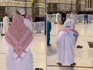 حمامة تقف بسلام على رأس رجل أثناء الصلاة بالحرم المكي