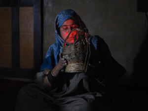 Kashmiri Kangri (Kanger) heater is being fired up by a housewife