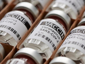 Some ampoules with ncov-2019 vaccine in a box