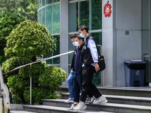 Apple Daily journalists were held for publishing articles urging foreign nations to impose sanctions on China.