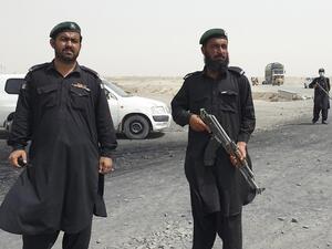 Frontier constabulary personnel stand guard in the border town of Chaman on July 16, 2021, following clashes between Afghan forces and Taliban fighters in Spin Boldak to retake the key border crossing with Pakistan