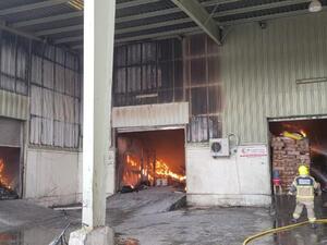 plastic materials warehouse  catches fire