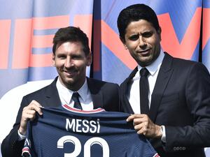 PSG's Qatari President Nasser Al-Khelaifi (R) poses along side Argentinian football player Lionel Messi as he holds-up his number 30 shirt during a press conference at the French football club Paris Saint-Germain's (PSG) Parc des Princes stadium in Paris on August 11, 2021 (Photo: AFP)