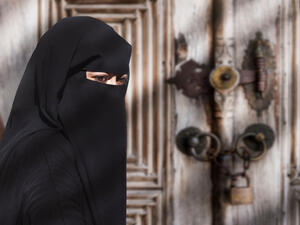 Portrait of a Middle Eastern woman wearing a black Niqab